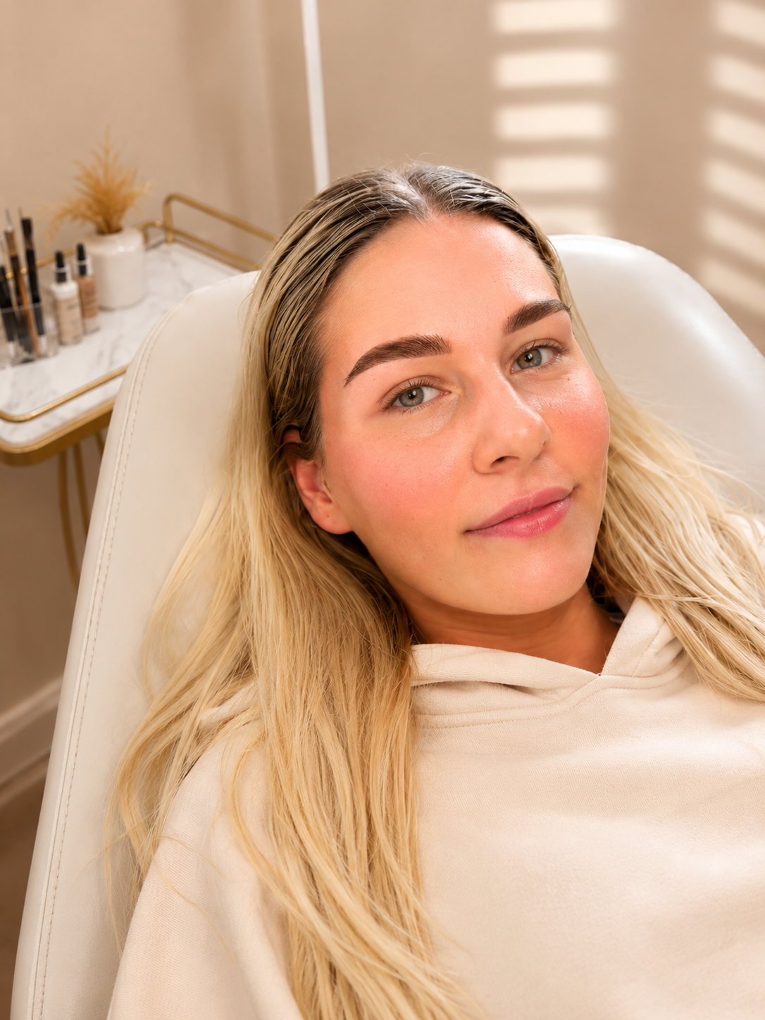 Beauty preparation portrait sculpted brows in the Victoria Beauty atelier chair.