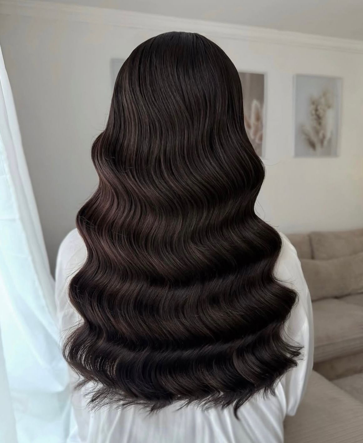 Hollywood waves — long, glossy dark waves styled to perfection.