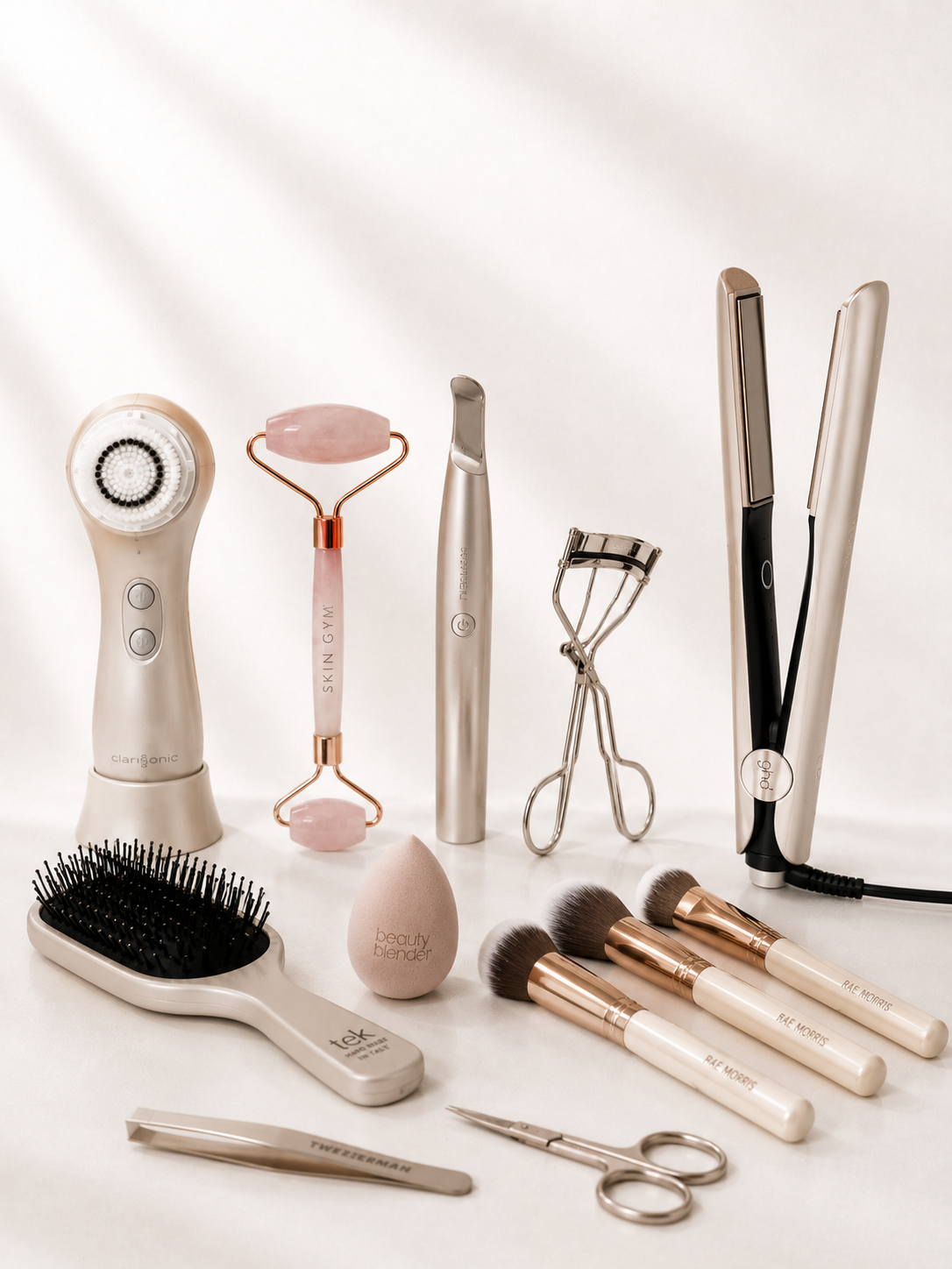 Atelier beauty tools cleansing brush, jade roller, lash curler, hair tools, and brushes Victoria Beauty boutique.
