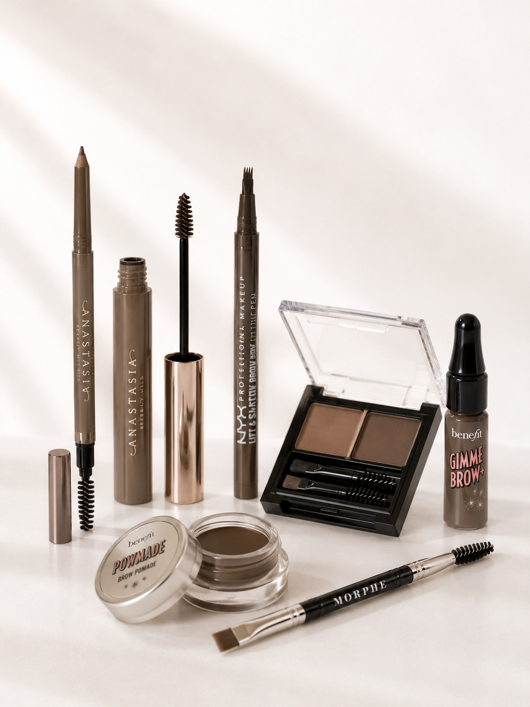 Brow artistry essentials pencils, gel, pomade, and palette Victoria Beauty boutique.